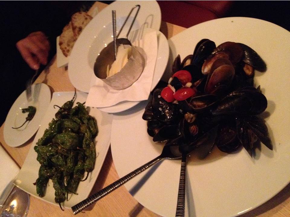 Figure 2. Fried shishito peppers and mussels provençal. This version of mussels is sans butter with the shaved cheese on the side.
