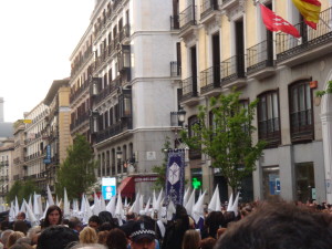 Figure 6. Penitentes with their medieval capirotes (pointed hats) in Madrid’s la Procesion de la Soledad (2014). As an American, I have to admit it was a bit uncomfortable to witness a parade of people dressed in all white robes and hoods. 