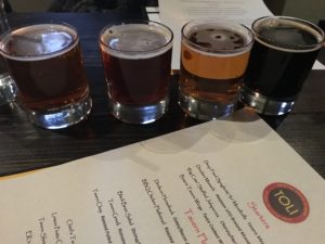 Figure 1. TOLI beer sampler, including the Sweet Baby Jesus Porter.