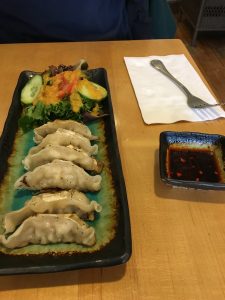 Figure 1. Gyoza with a salad. The ginger salad dressing is a house specialty that can be bought in bottles for home use.