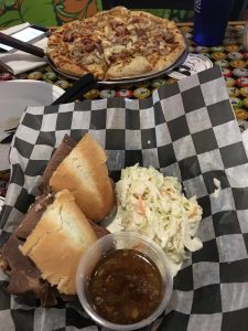 Figure 4. Tap House French dip sandwich and BBQ pork pizza.