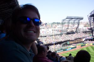 Figure 4. Jeffery Hall enjoying a Mariners game in sunny Seattle (Labor Day weekend 2003). My bro-in-law was visiting from another state, and he has made it a habit to see a baseball game in as many of our nation’s stadiums as possible. We saw Ichiro Suzuki, a player now on track to reach and exceed 3,000 hits.